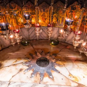 A silver star marks the traditional site of the birth of Jesus in a grotto underneath Bethlehem's Church of the Nativity, Palestine.